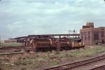 BM 1230 & BM 802 haul welded rail for the MBTA Green Line 'D' Branch past Boston Engine Terminal